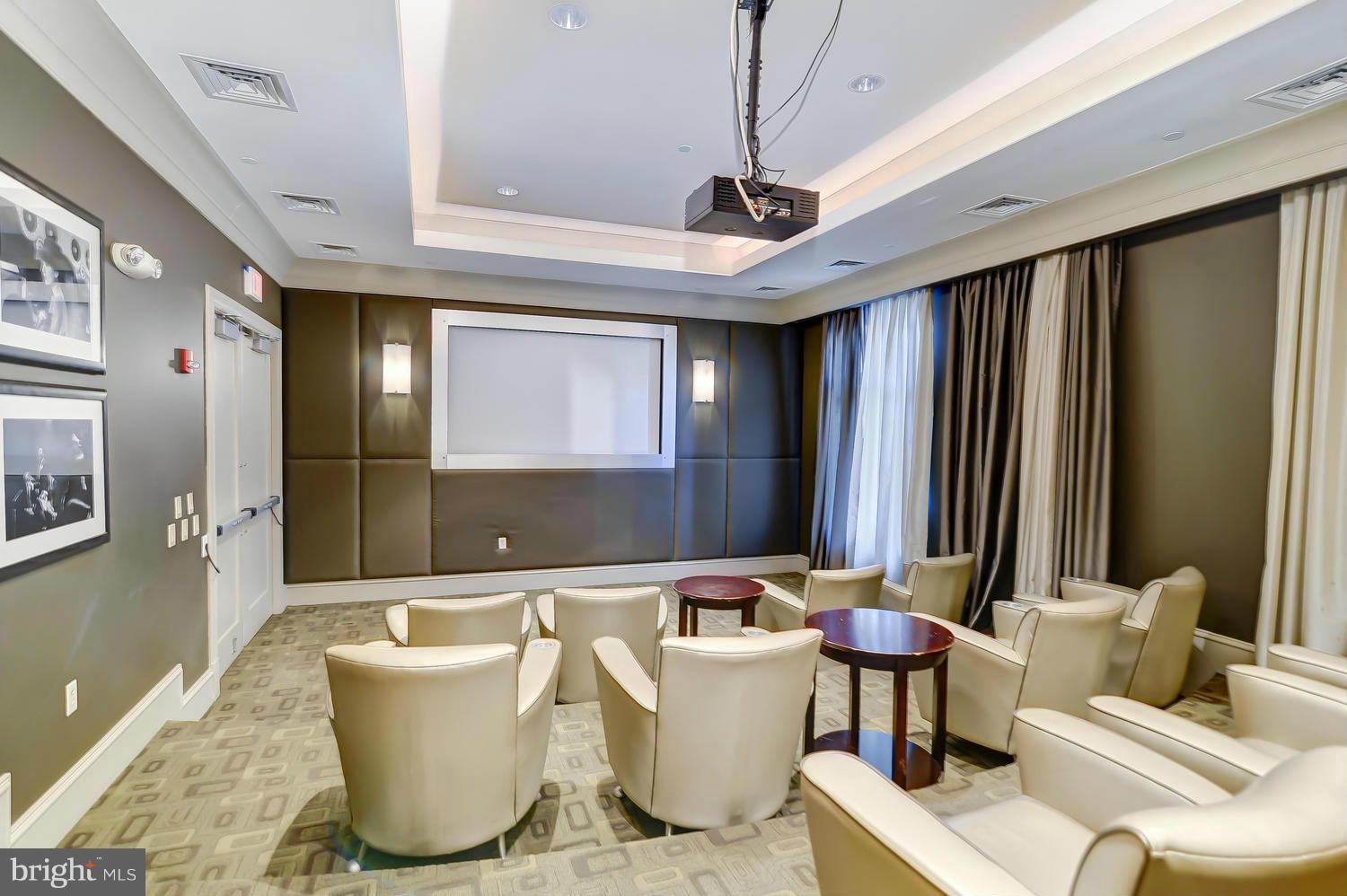 851 North Glebe Road, Unit 902 Arlington, VA 22203 - Photo 21 of 30 a living room with furniture and a large window