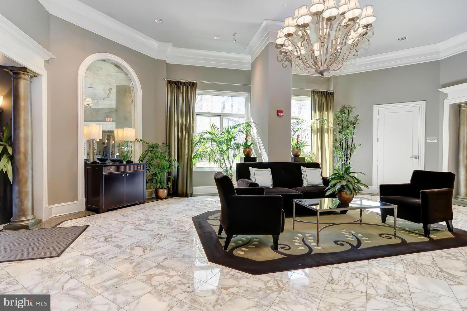 851 North Glebe Road, Unit 902 Arlington, VA 22203 - Photo 23 of 30 a living room with furniture and a chandelier