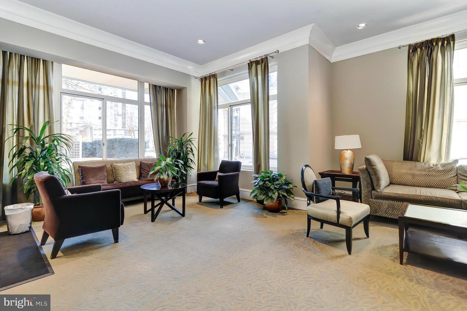 851 North Glebe Road, Unit 902 Arlington, VA 22203 - Photo 24 of 30 a living room with furniture and a large window