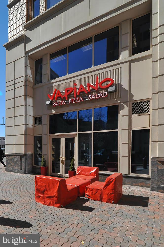 851 North Glebe Road, Unit 902 Arlington, VA 22203 - Photo 27 of 30 a view of a cafe with an outdoor seating