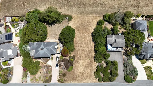 an aerial view of a house with a garden