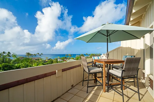 an outdoor space with furniture and umbrella