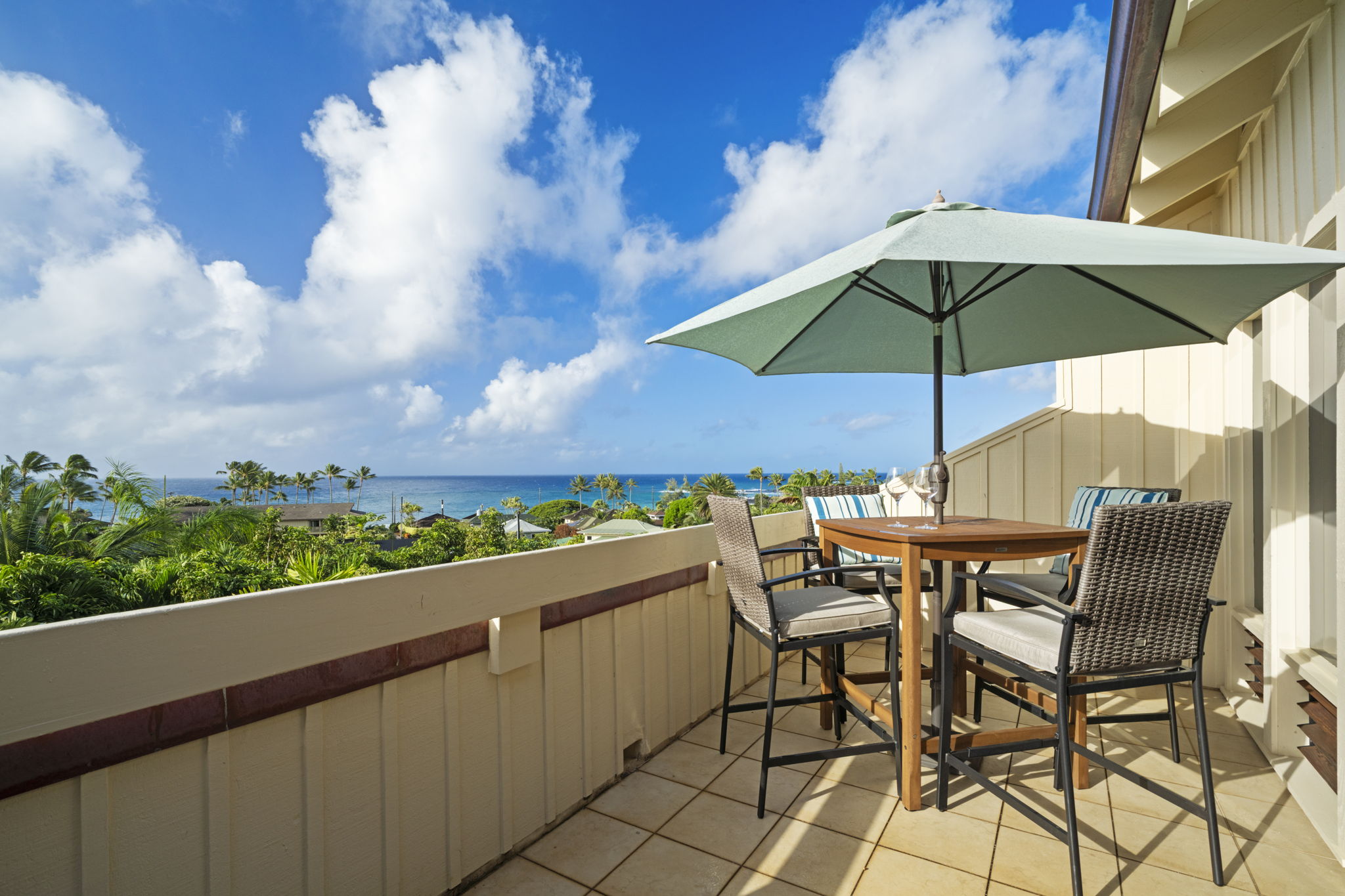 an outdoor space with furniture and umbrella