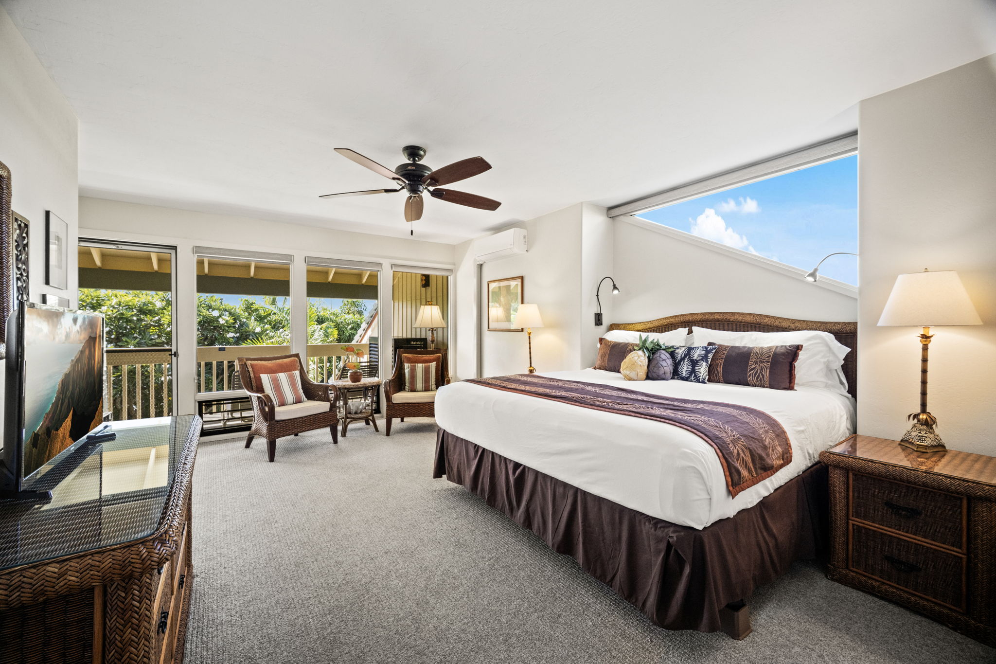 2371 Ho'ohu Road, Unit 610 Koloa, HI 96756 - Photo 13 of 29 a spacious bedroom with a bed a chandelier and a large window