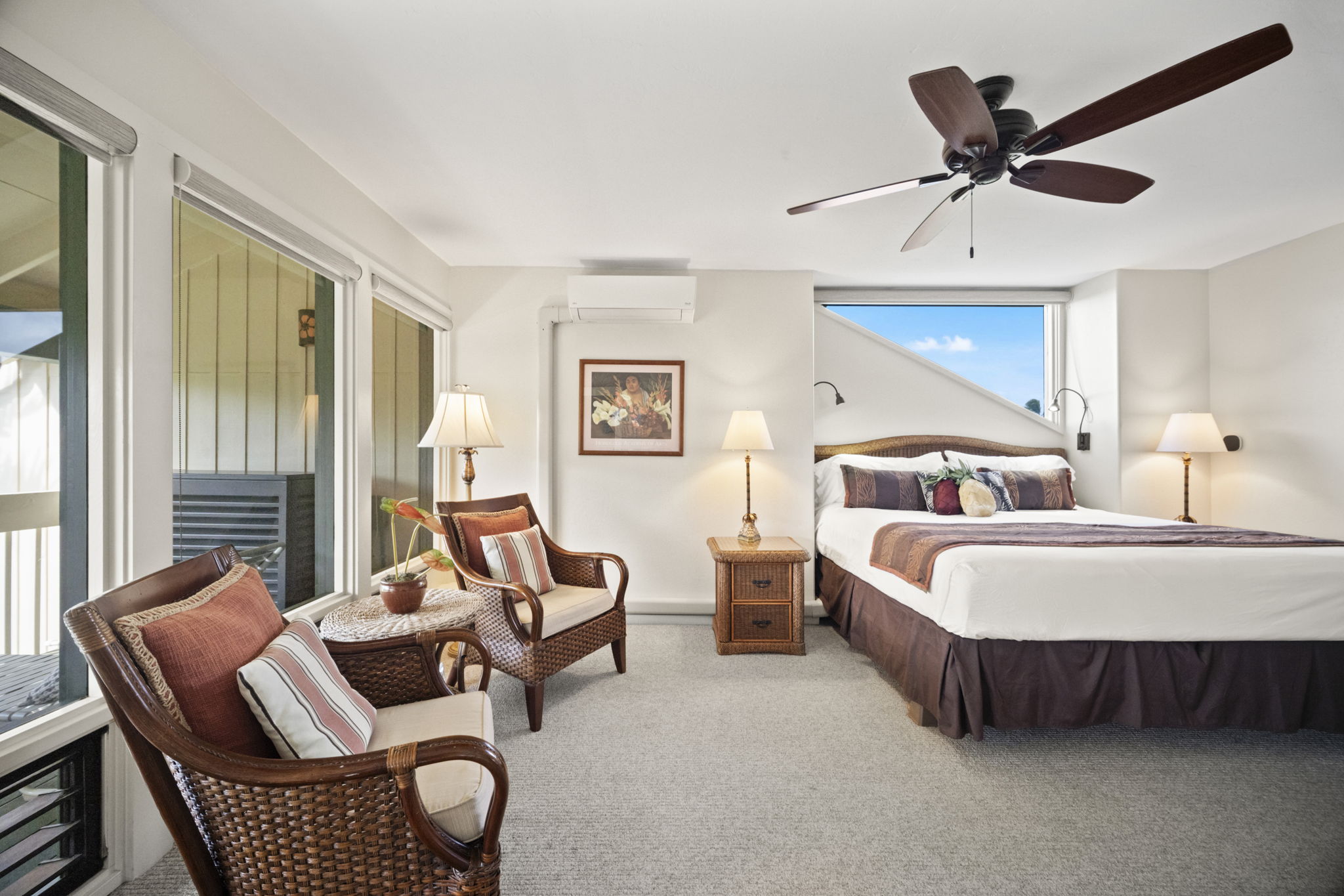 2371 Ho'ohu Road, Unit 610 Koloa, HI 96756 - Photo 14 of 29 a bedroom with furniture and a large window