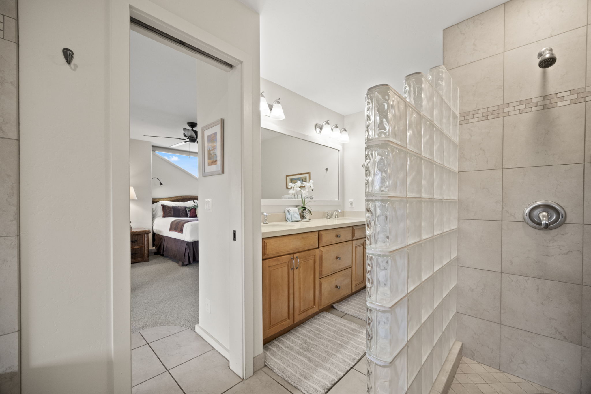 2371 Ho'ohu Road, Unit 610 Koloa, HI 96756 - Photo 15 of 29 a spacious bathroom with a double vanity sink toilet and shower