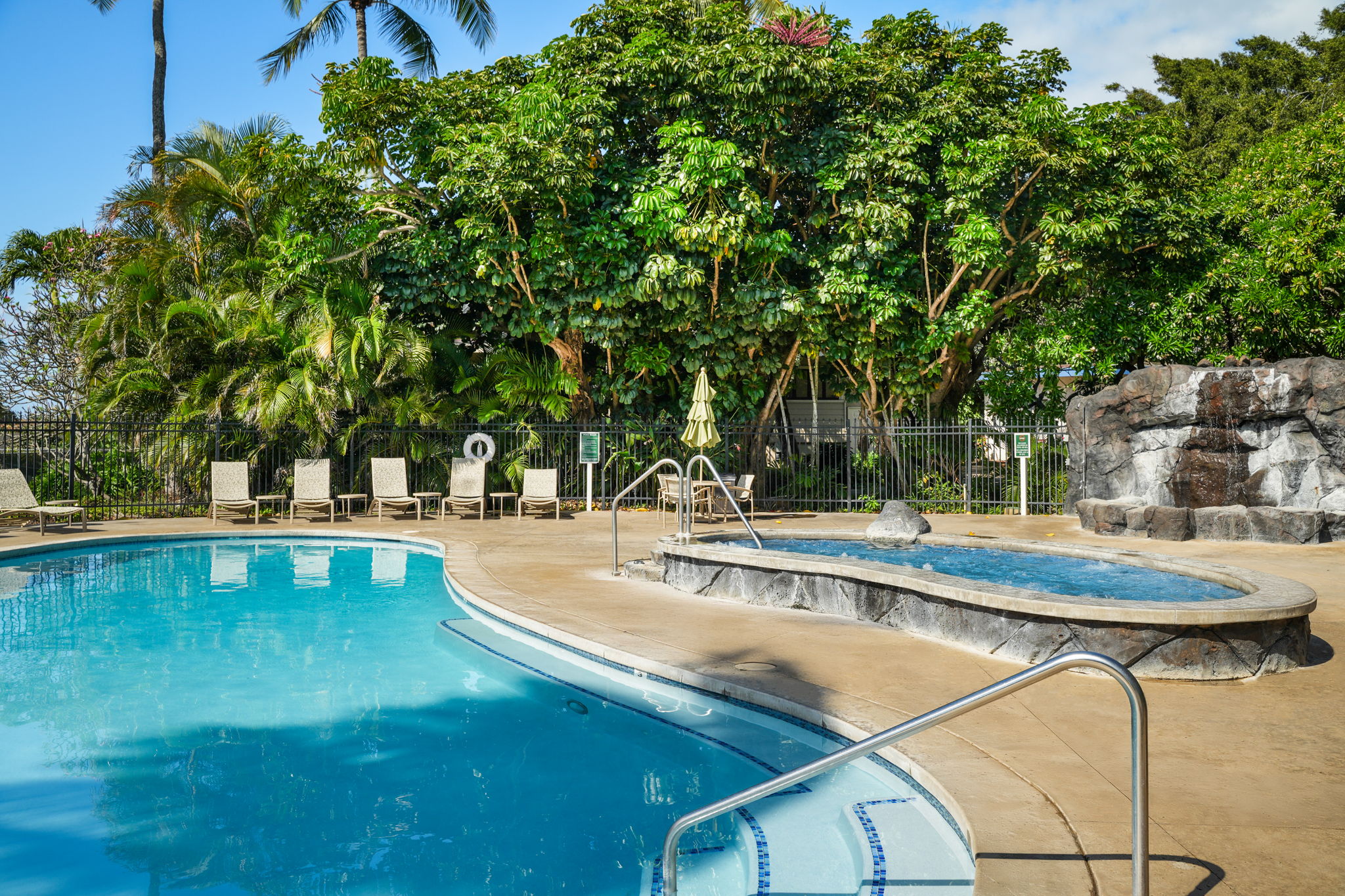 2371 Ho'ohu Road, Unit 610 Koloa, HI 96756 - Photo 24 of 29 a view of a swimming pool with lounge chair