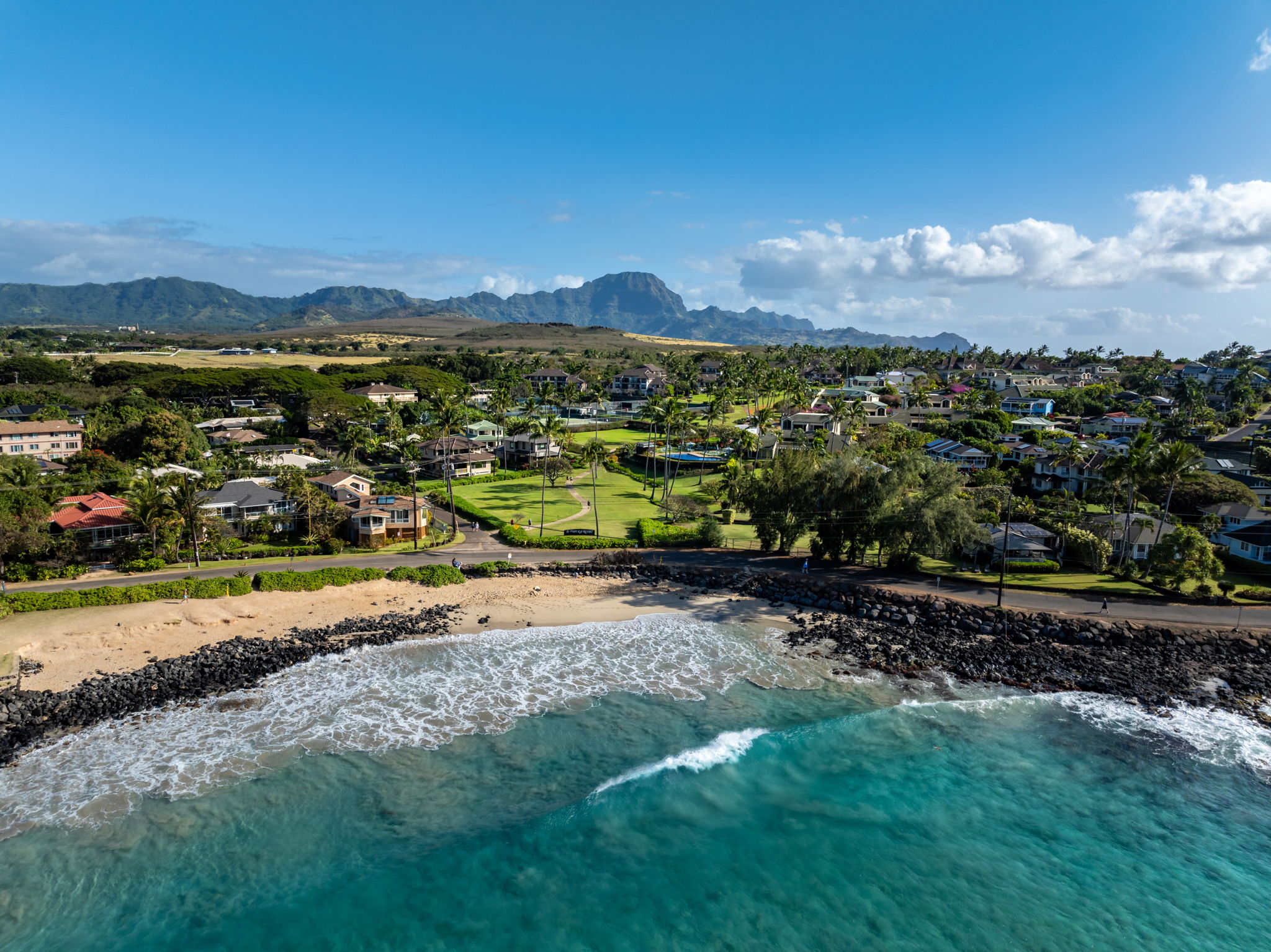 2371 Ho'ohu Road, Unit 610 Koloa, HI 96756 - Photo 29 of 29 a view of a city with mountains in the background