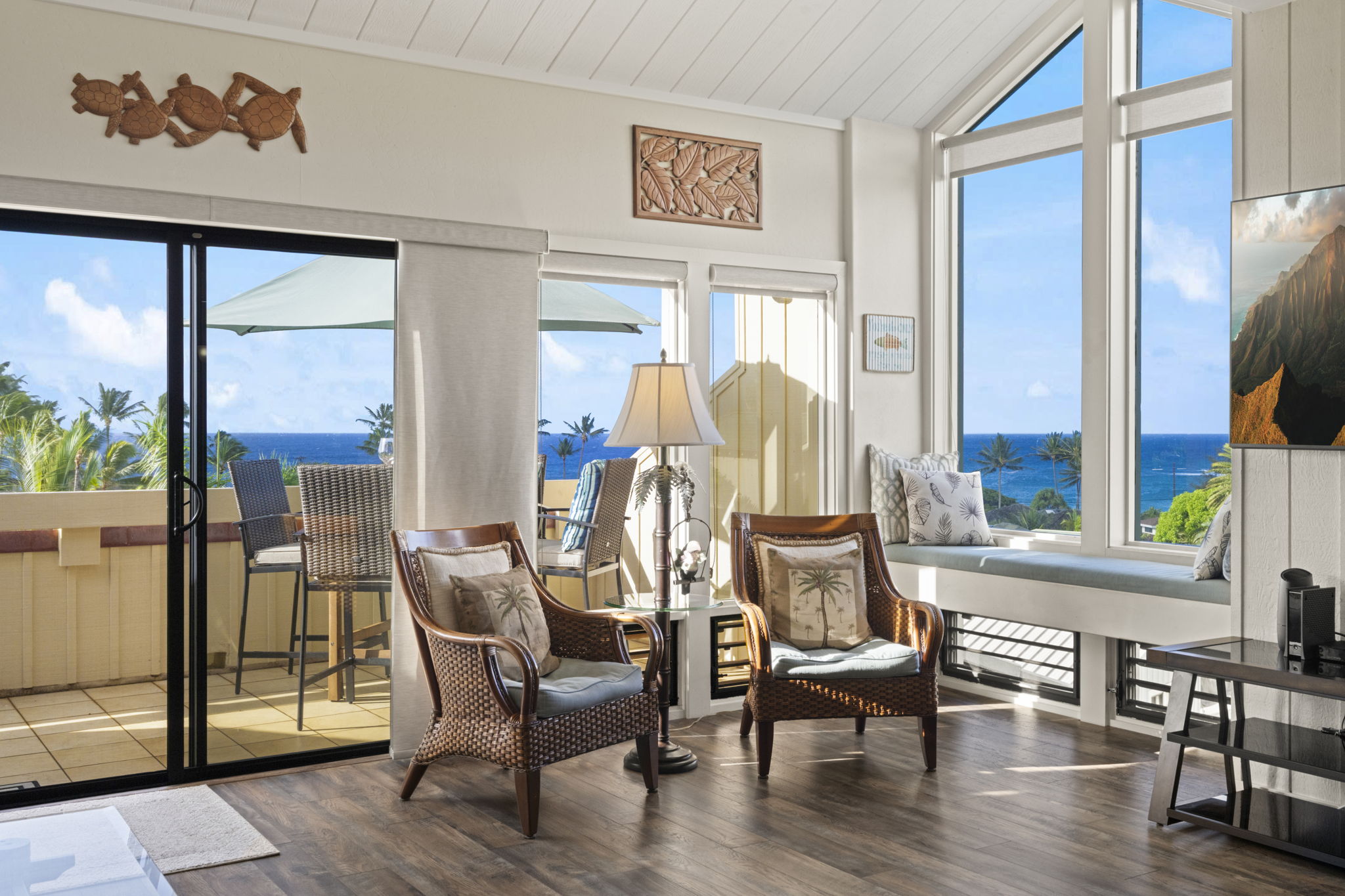 2371 Ho'ohu Road, Unit 610 Koloa, HI 96756 - Photo 6 of 29 a view of a dining room with furniture a chandelier and wooden floor