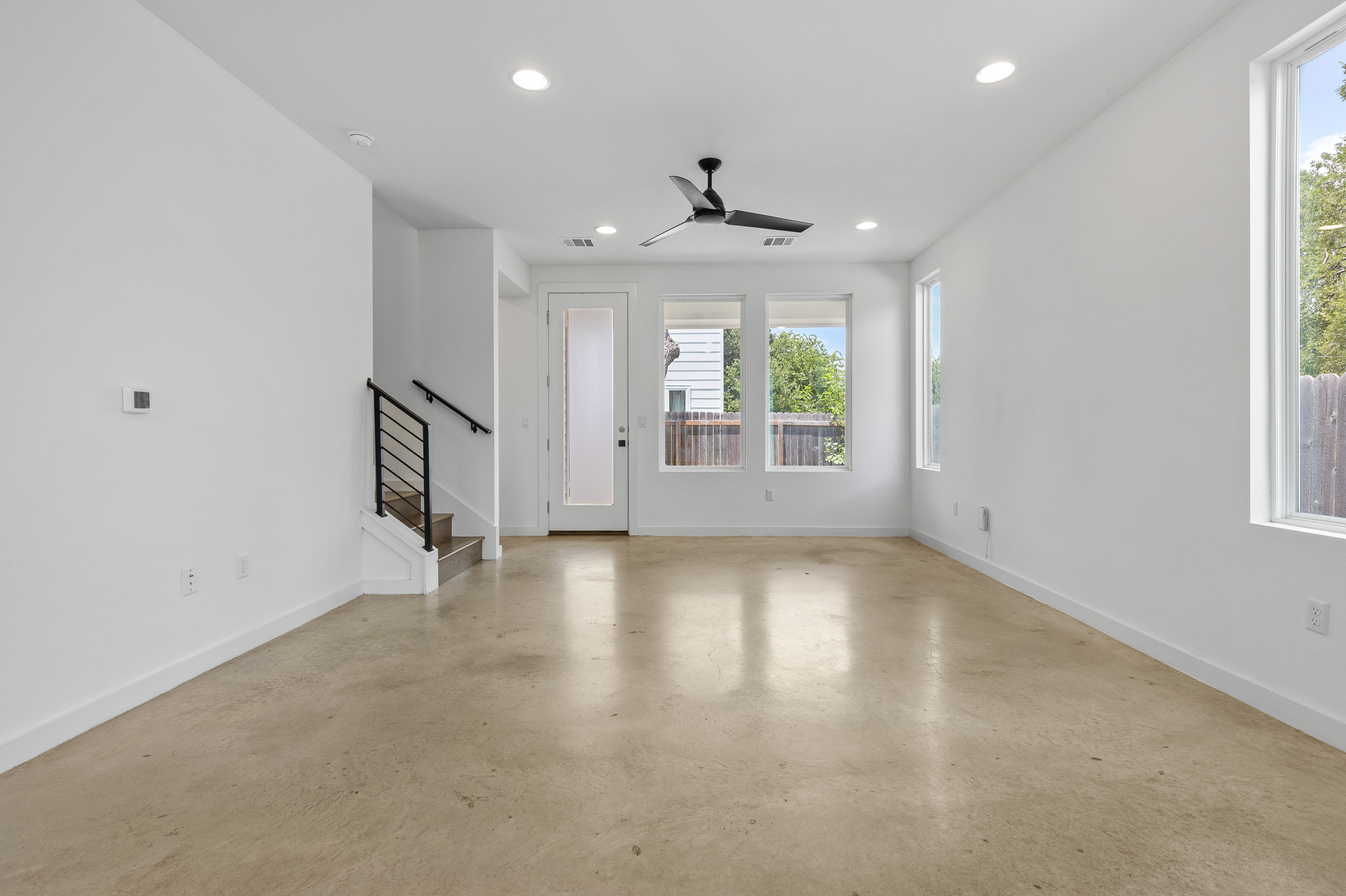 2604 Wheless Lane, Unit 1 Austin, TX 78723 - Photo 6 of 38 Polished concrete floors throughout main level create a modern, easy-to-maintain foundation with contemporary appeal.