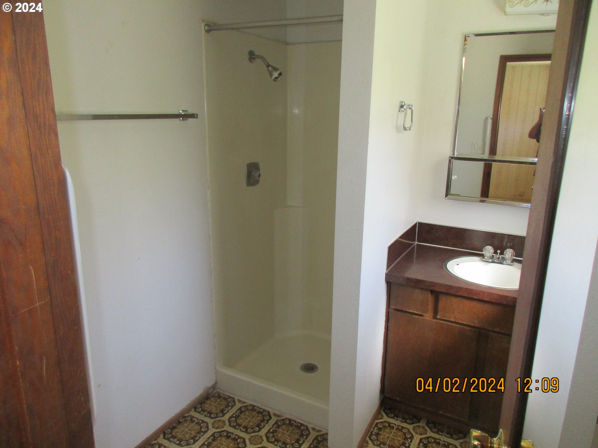4545 Northeast Ridenour Street Winchester, OR 97495 - Photo 18 of 20 a bathroom with a sink and mirror
