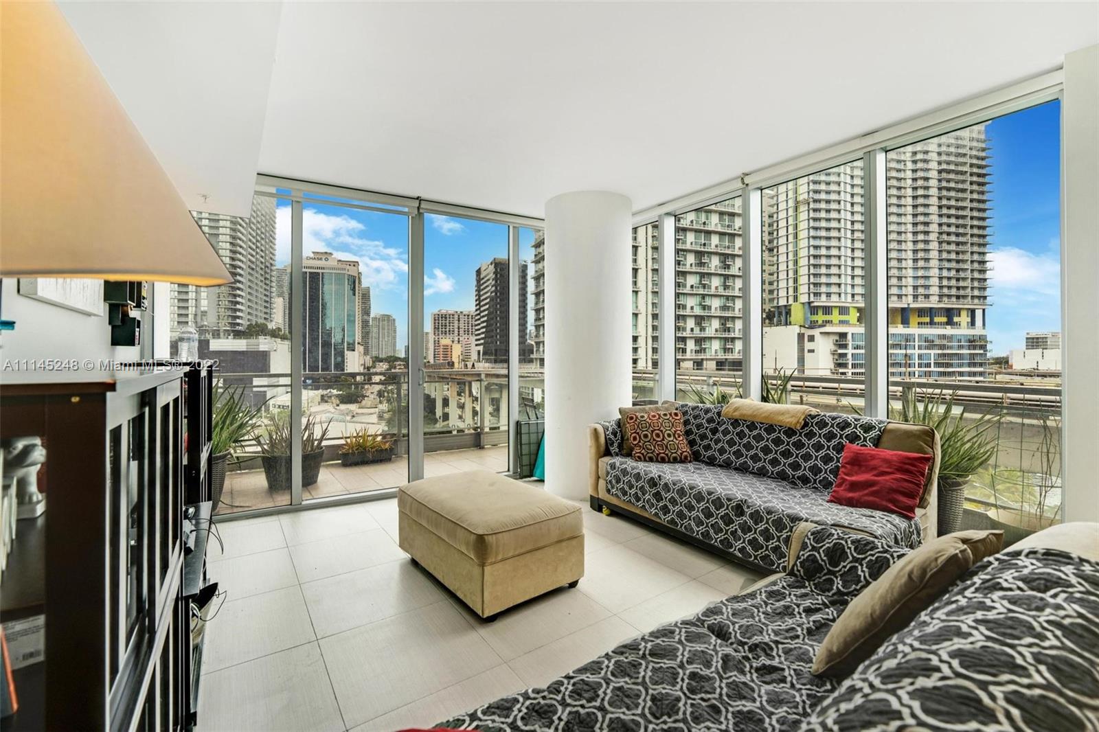 92 Southwest 3rd Street, Unit 901 Miami, FL 33130 - Photo 2 of 35 a living room with furniture and a large window