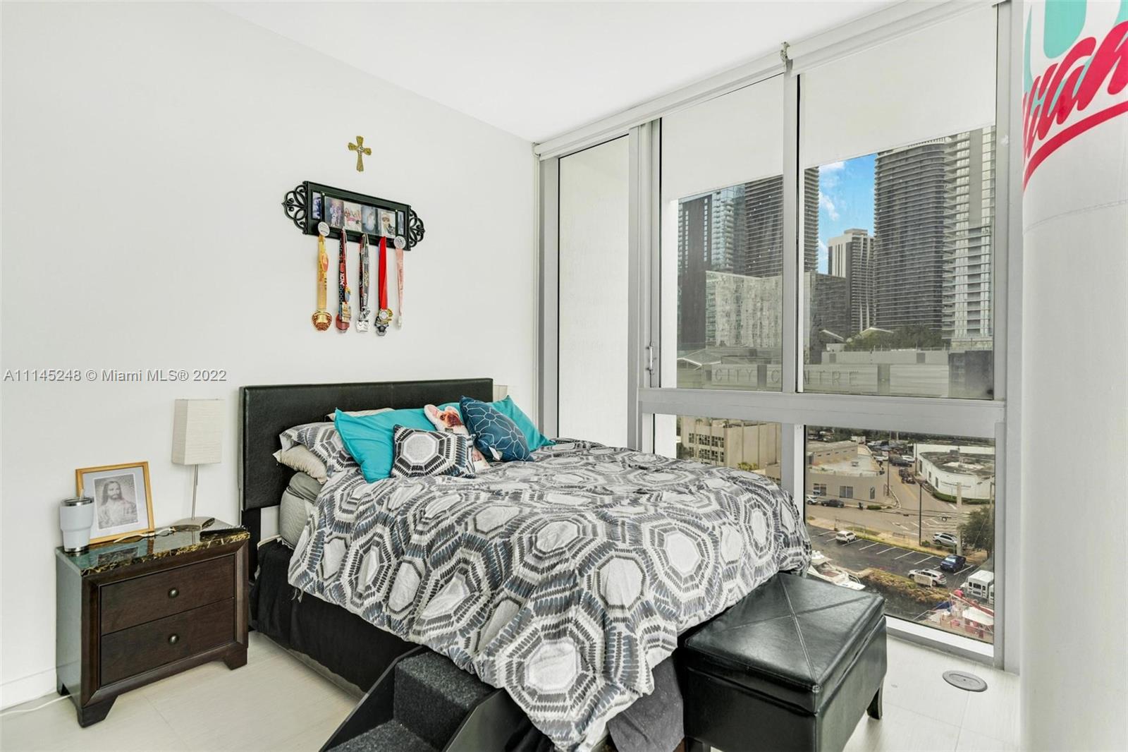 92 Southwest 3rd Street, Unit 901 Miami, FL 33130 - Photo 21 of 35 a bedroom with a bed and window