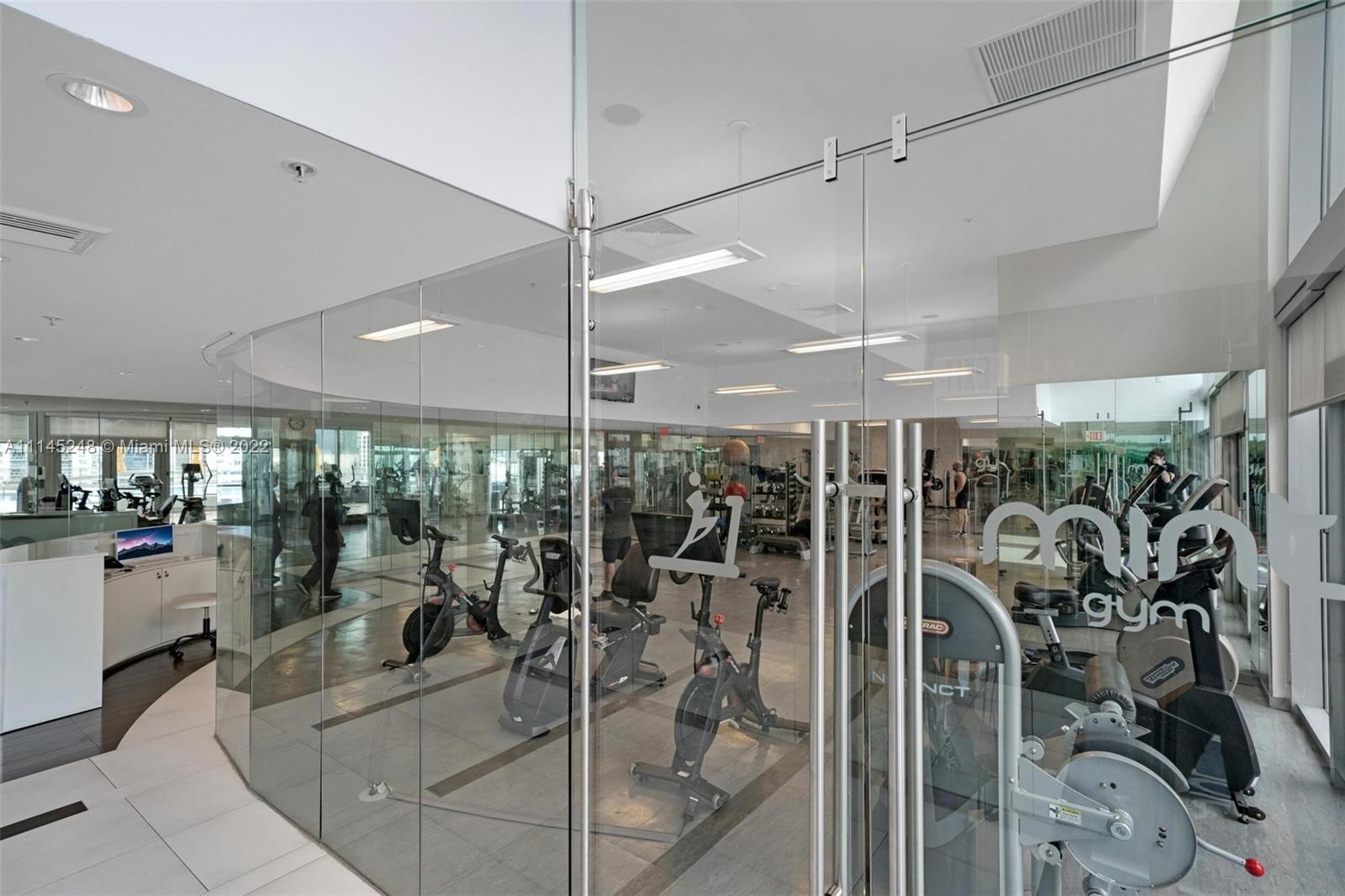 92 Southwest 3rd Street, Unit 901 Miami, FL 33130 - Photo 29 of 35 a view of a room with gym equipment