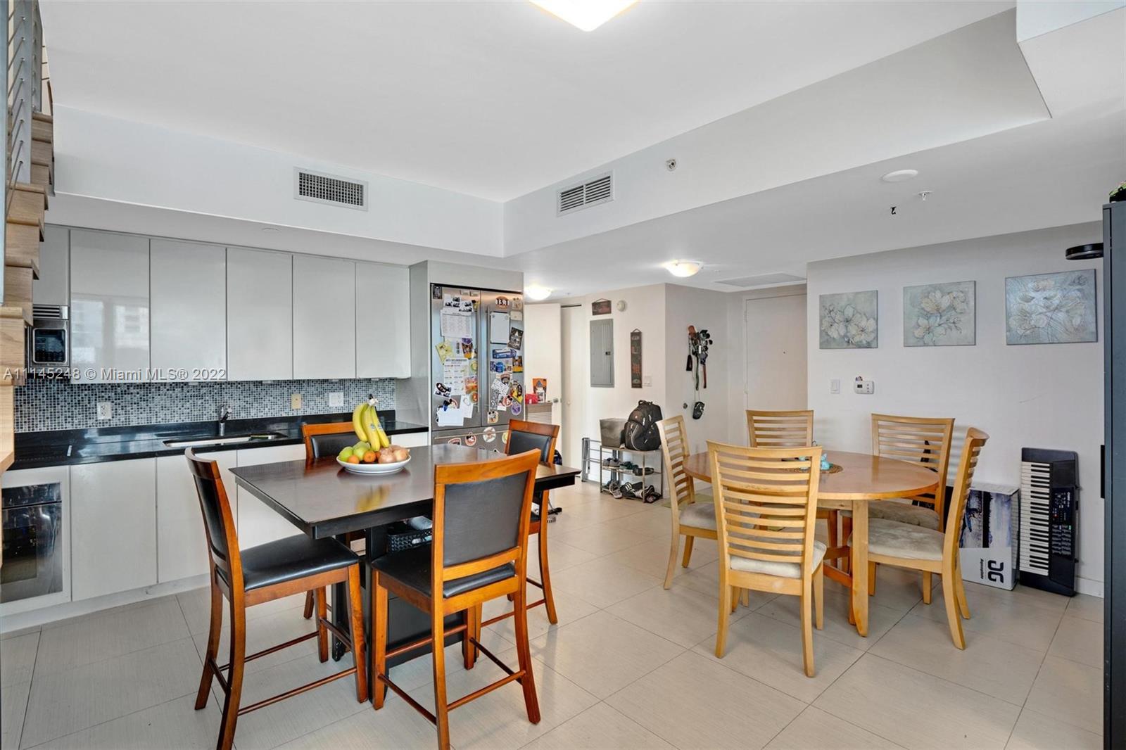 92 Southwest 3rd Street, Unit 901 Miami, FL 33130 - Photo 9 of 35 a view of a dining room with furniture