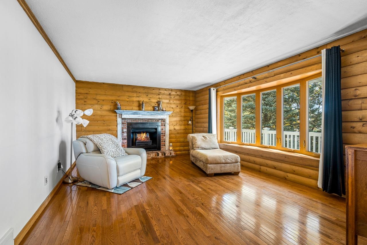 17097 Goodrich Road Davis, IL 61019 - Photo 38 of 45 a living room with furniture and a fireplace