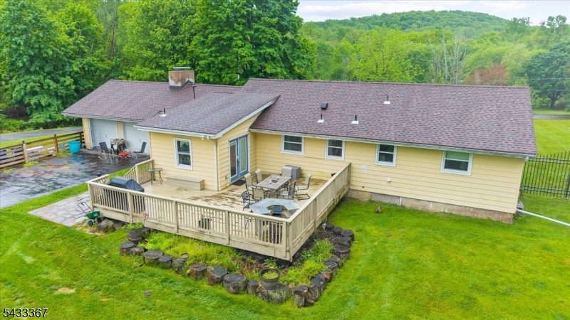 650 Woodglen Road Glen Gardner, NJ 08826 - Photo 19 of 28 a aerial view of a house with a big yard and large trees