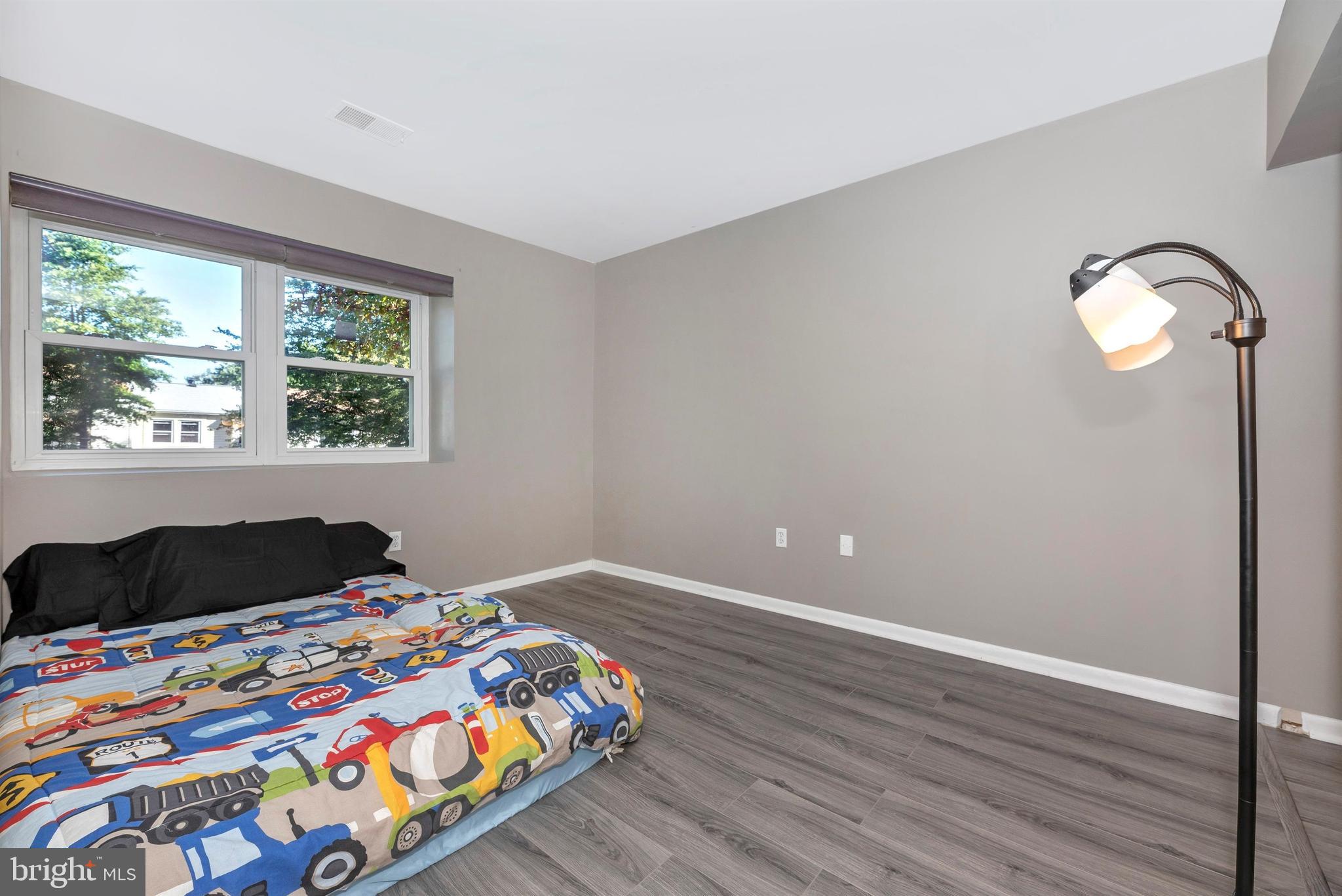 17417 Hoskinson Road Poolesville, MD 20837 - Photo 33 of 45 a bedroom with a bed and a window