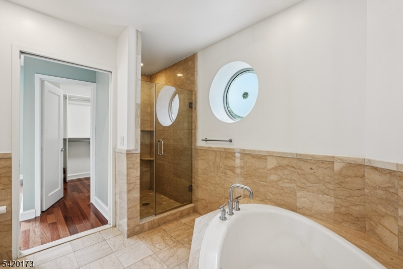 8100 River Road, Unit 210 North Bergen, NJ 07047 - Photo 17 of 25 a bathroom with a sink and a mirror