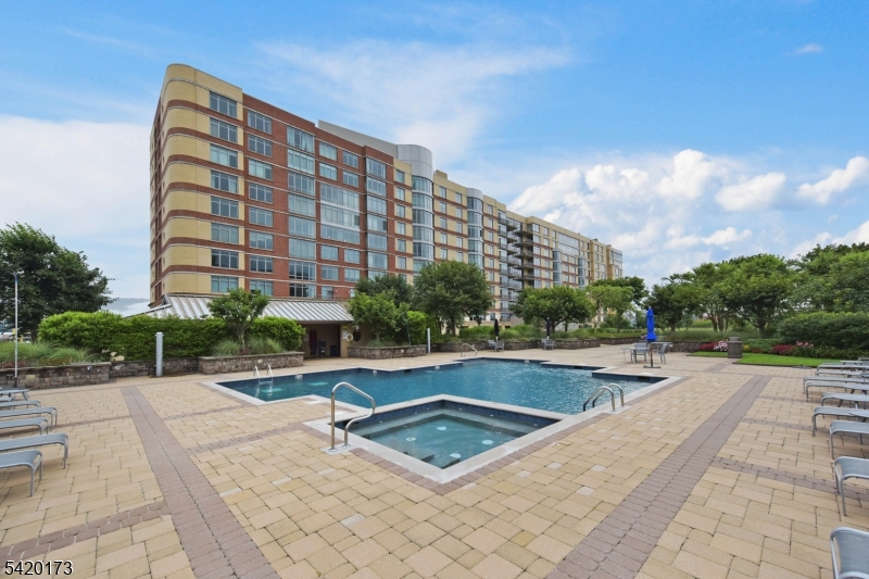 8100 River Road, Unit 210 North Bergen, NJ 07047 - Photo 24 of 25 a view of building with swimming pool and sitting area