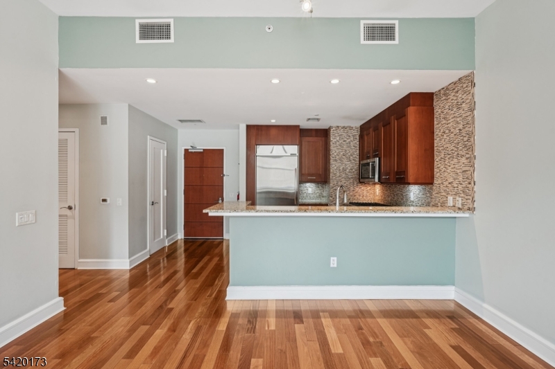 8100 River Road, Unit 210 North Bergen, NJ 07047 - Photo 5 of 25 a view of kitchen with wooden floor
