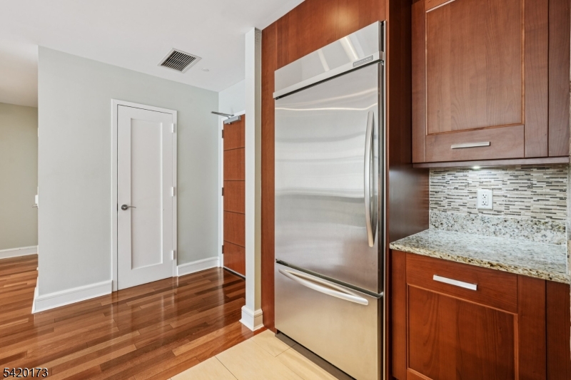 8100 River Road, Unit 210 North Bergen, NJ 07047 - Photo 10 of 25 a kitchen with granite countertop a refrigerator and a sink