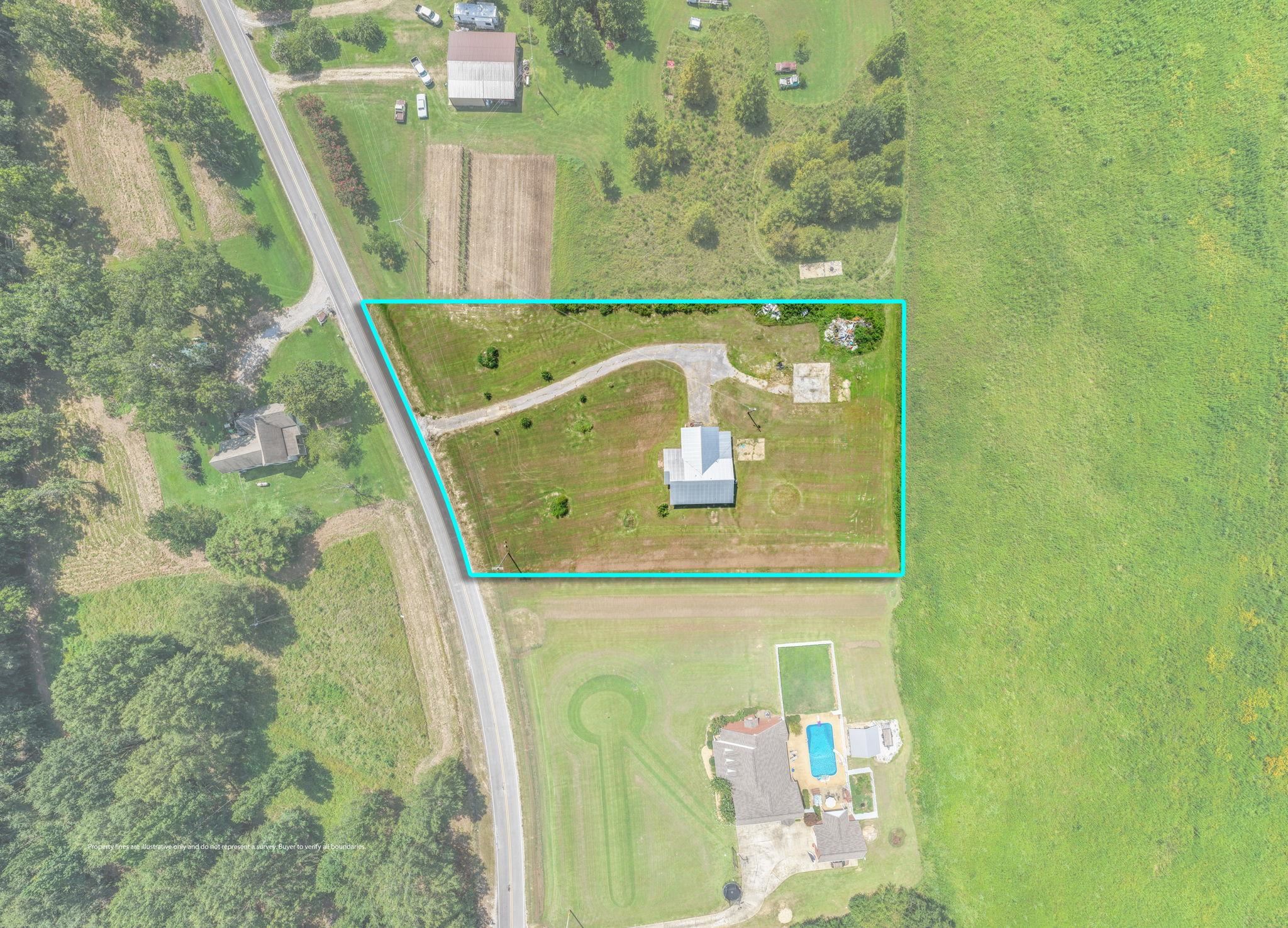 60116 Seminole Road Smithville, MS 38870 - Photo 29 of 38 Aerial property overview featuring a single-story residence with a metal roof, an elongated driveway, and surrounding open land