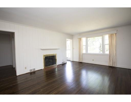 252 Converse Road Marion, MA 02738 - Photo 5 of 13 a view of empty room with wooden floor and fireplace