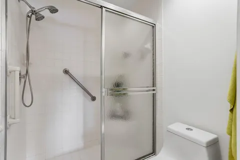 an aerial view of a house with a lake view