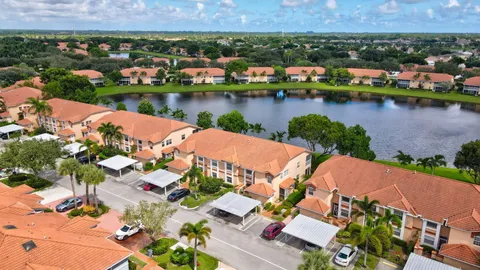 a front view of a house with a yard table and chairs