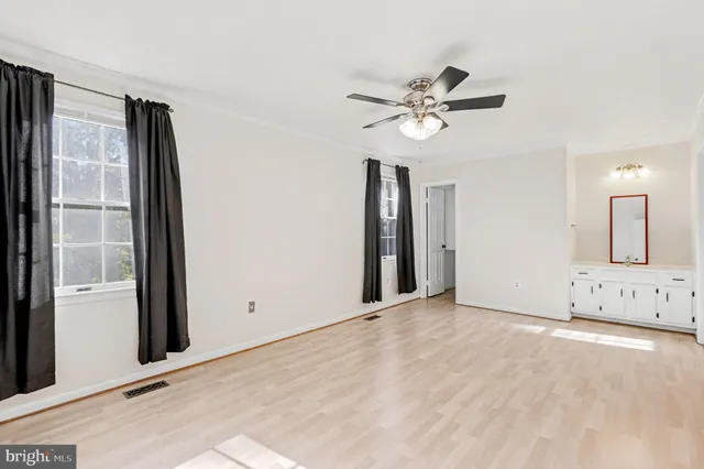 a view of a livingroom with a chandelier fan