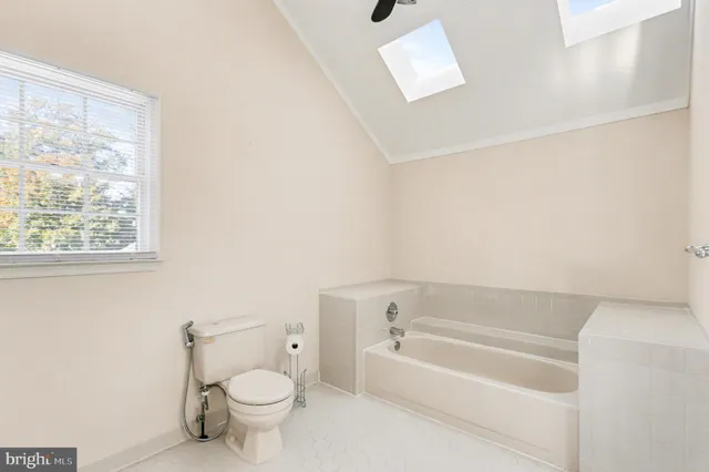 a bathroom with a toilet a sink and a bathtub