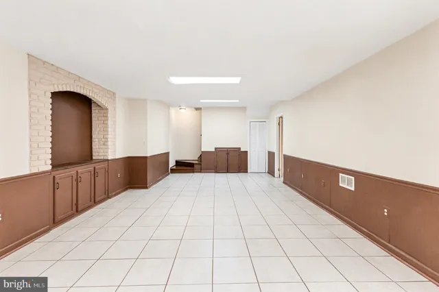 a large room with a bed and furniture