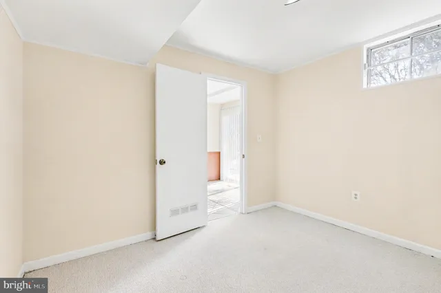 an empty room with a bathroom