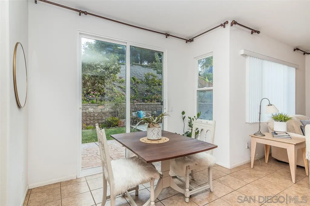 3506 Rock Ridge Road Carlsbad, CA 92010 - Photo 13 of 25 a view of a dining room with furniture window and outside view