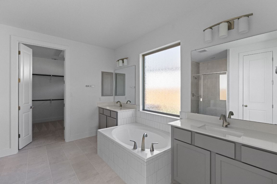 1409 Treasure Map View Leander, TX 78641 - Photo 22 of 40 Primary Bath retreat with dual vanities & garden tub