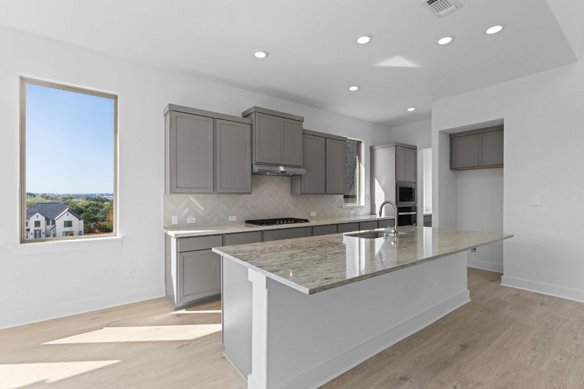 1409 Treasure Map View Leander, TX 78641 - Photo 7 of 40 Large Center Island in Kitchen