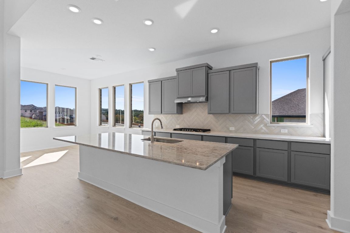 1409 Treasure Map View Leander, TX 78641 - Photo 8 of 40 Large Center Island in Kitchen