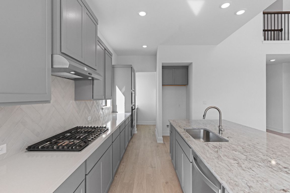 1409 Treasure Map View Leander, TX 78641 - Photo 9 of 40 Stunning finishes in Light & Bright Kitchen