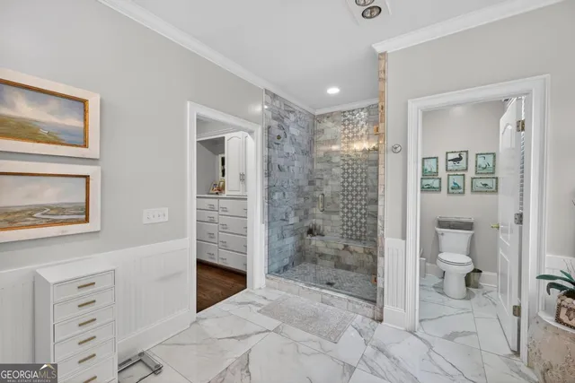 a living room with furniture a fireplace and a potted plant