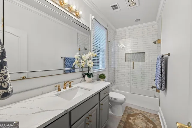 a spacious bedroom with two beds and a window