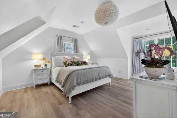 a dining room with furniture a chandelier and a rug
