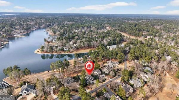 an aerial view of a house with a lake view