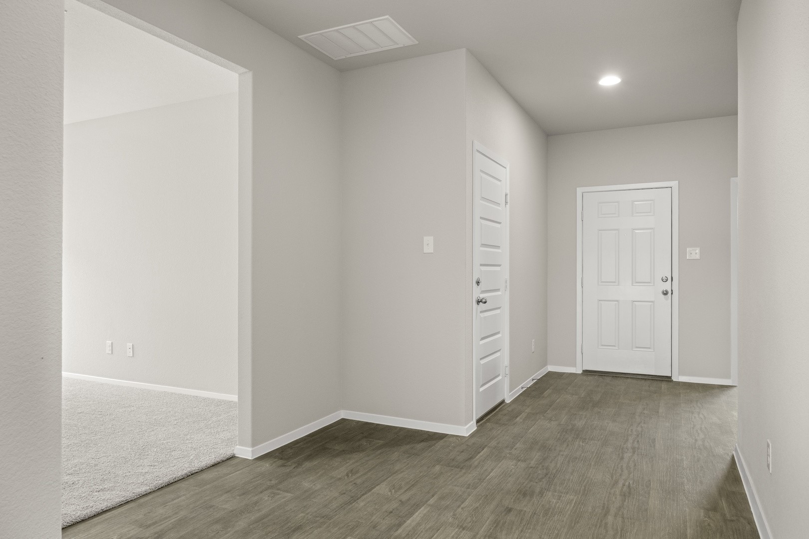 5509 Sacra Cove Austin, TX 78747 - Photo 11 of 38 an empty room with wooden floor and windows