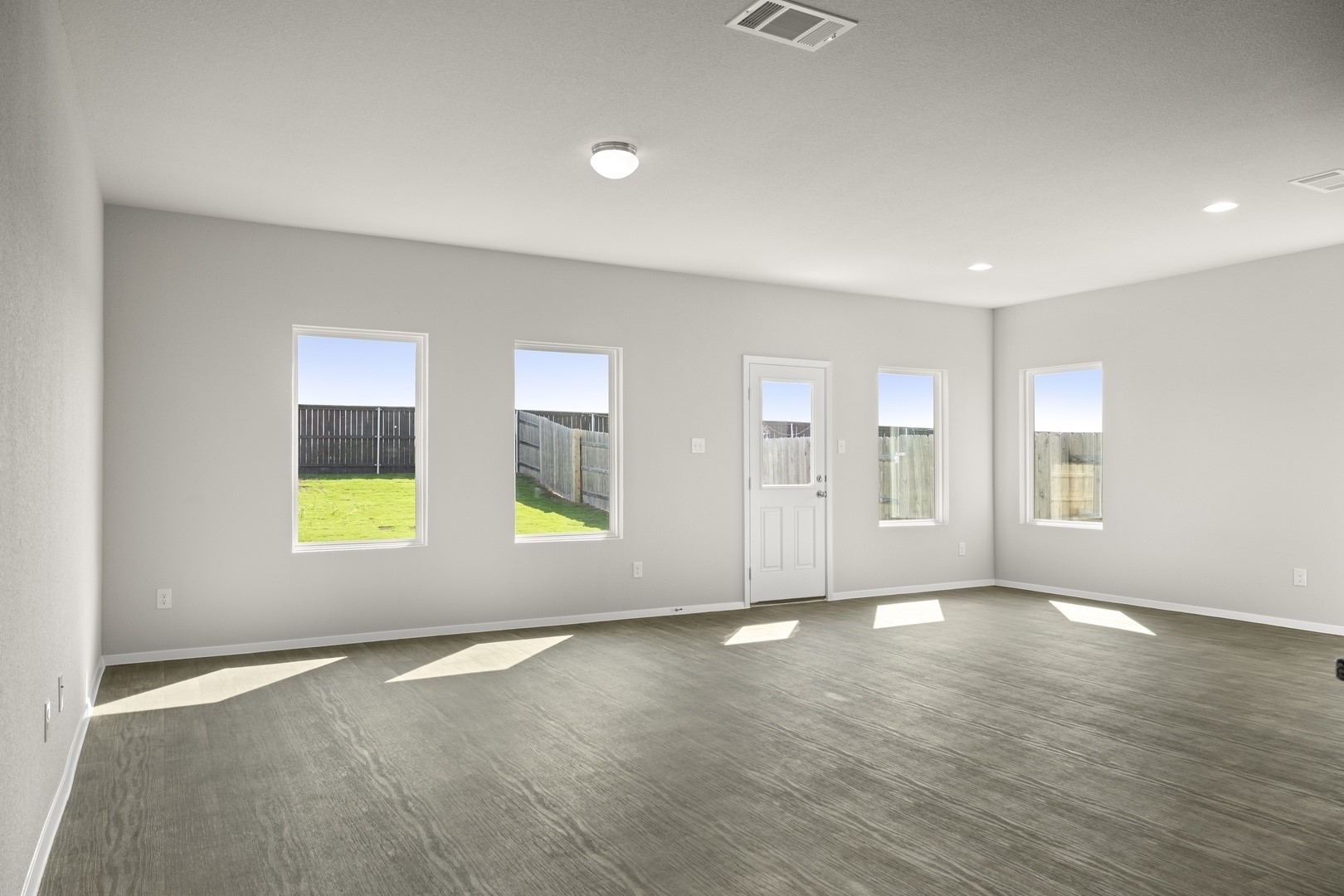 5509 Sacra Cove Austin, TX 78747 - Photo 12 of 38 an empty room with windows