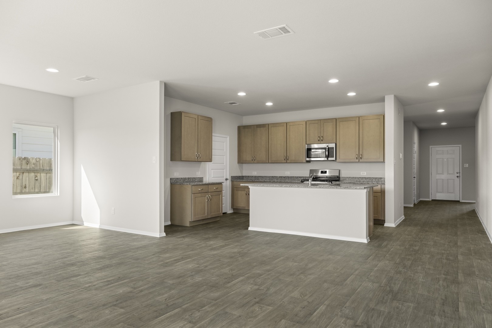 5509 Sacra Cove Austin, TX 78747 - Photo 15 of 38 a large kitchen with a large counter top appliances and cabinets