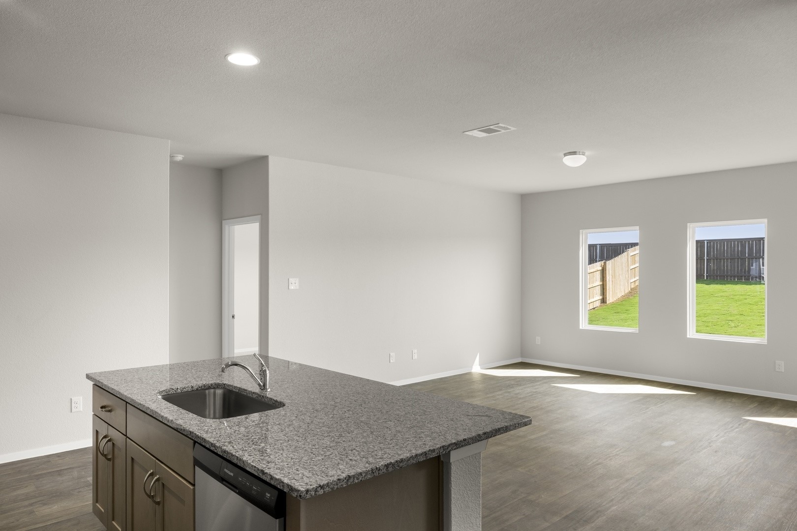 5509 Sacra Cove Austin, TX 78747 - Photo 23 of 38 a kitchen with granite countertop a sink and a window
