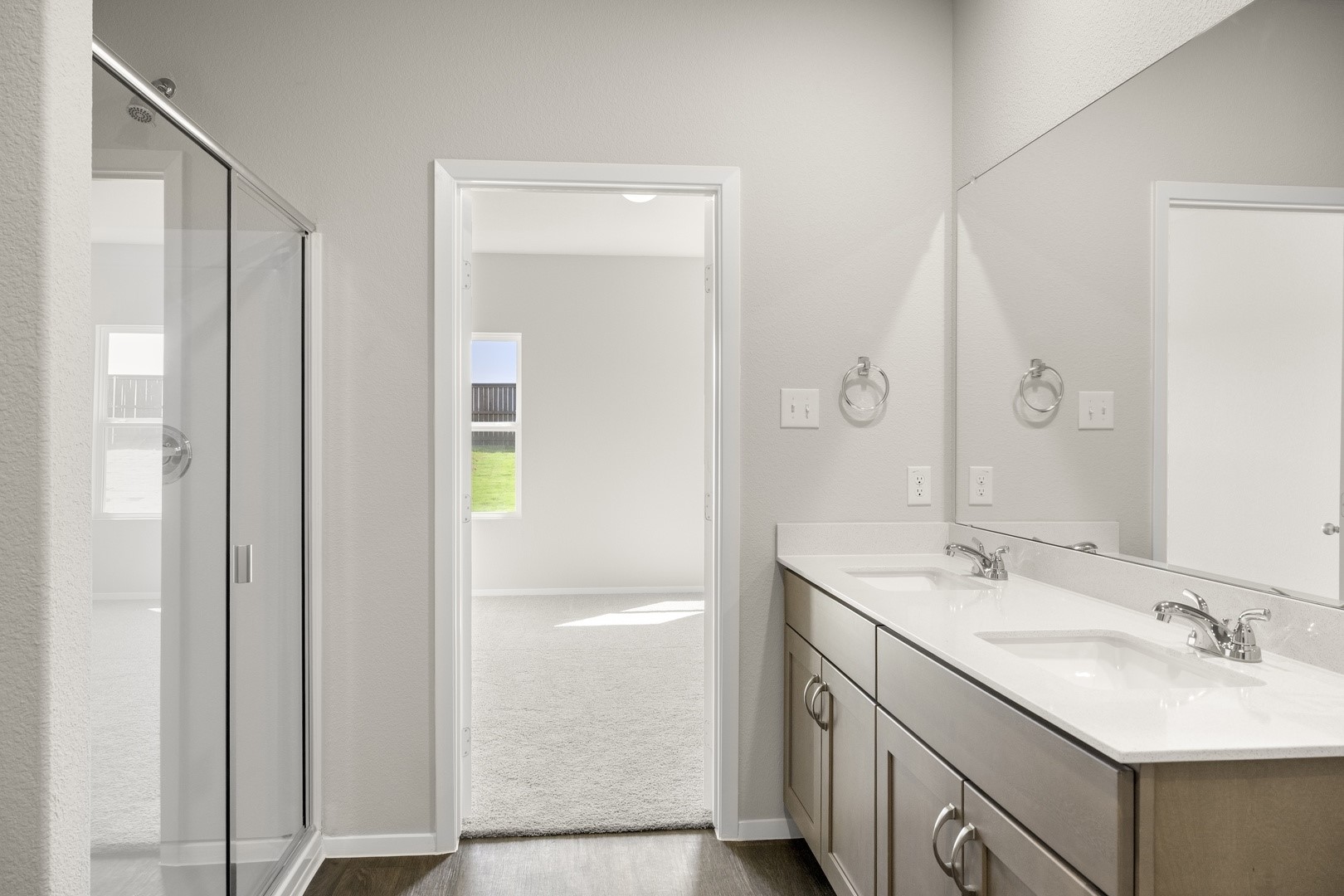5509 Sacra Cove Austin, TX 78747 - Photo 32 of 38 a bathroom with a granite countertop sink and a mirror