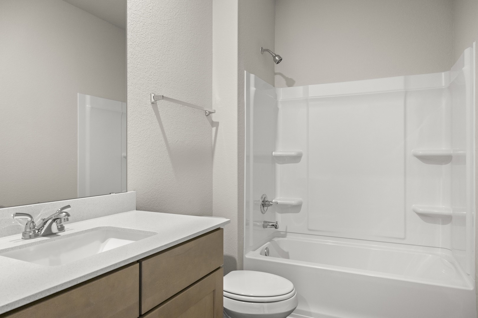 5509 Sacra Cove Austin, TX 78747 - Photo 35 of 38 a bathroom with a granite countertop sink toilet and shower
