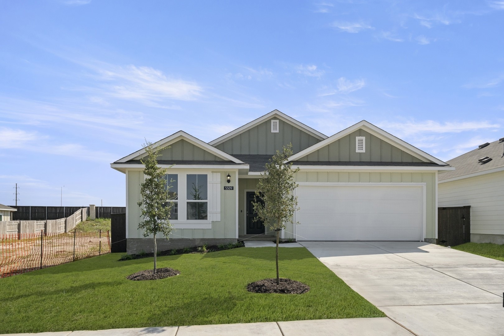 5509 Sacra Cove Austin, TX 78747 - Photo 4 of 38 a front view of a house with a yard